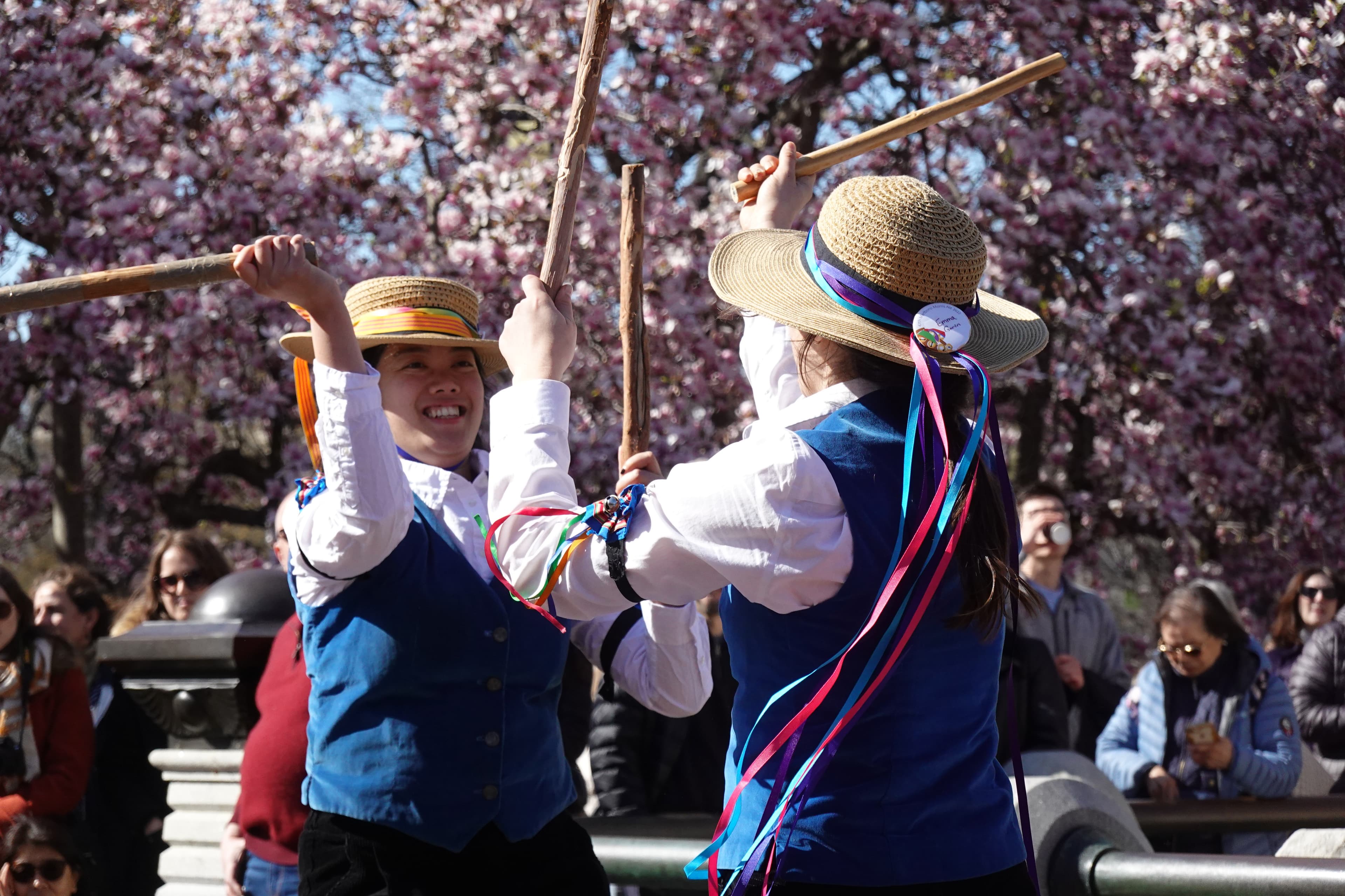 Ring O' Bells Morris dancers performing outdoors with handkerchiefs and bells