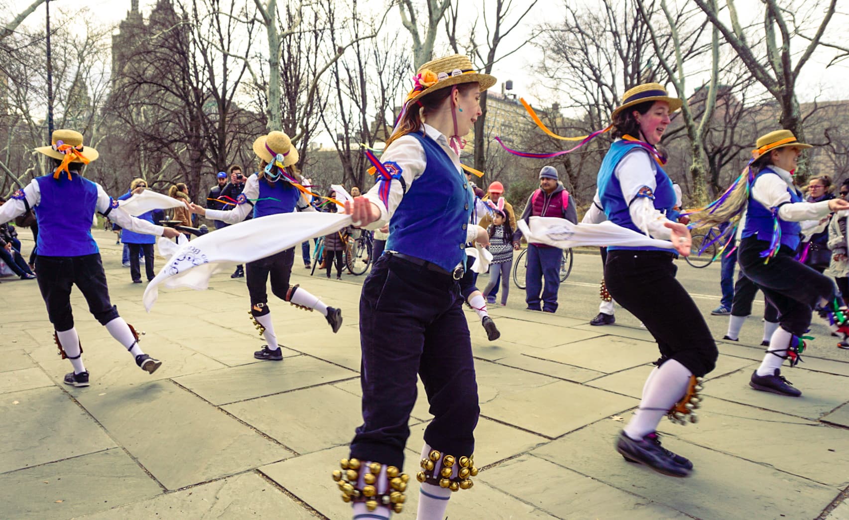Ring O' Bells Morris dancers performing outdoors with handkerchiefs and bells